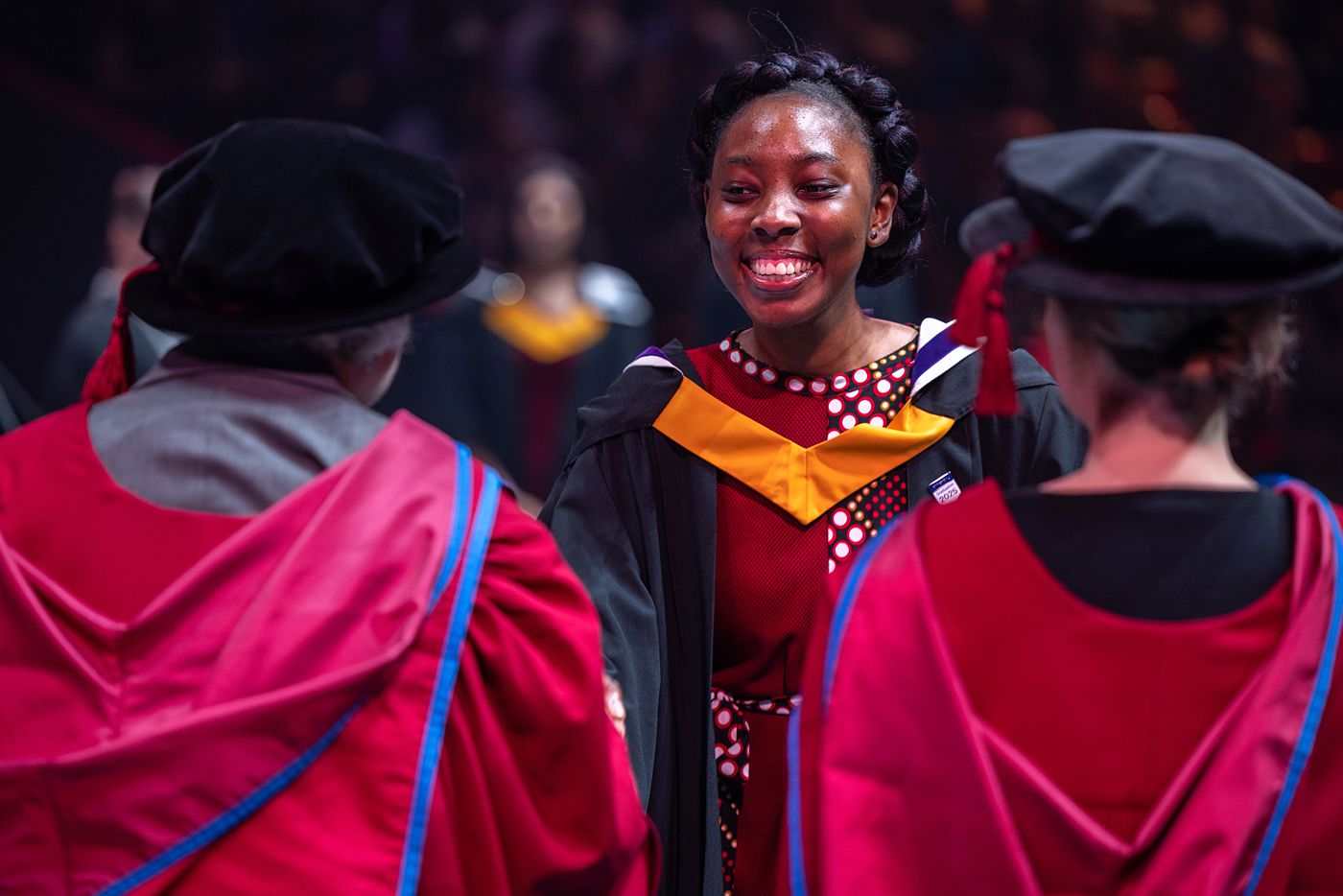 An Imperial graduate with gown