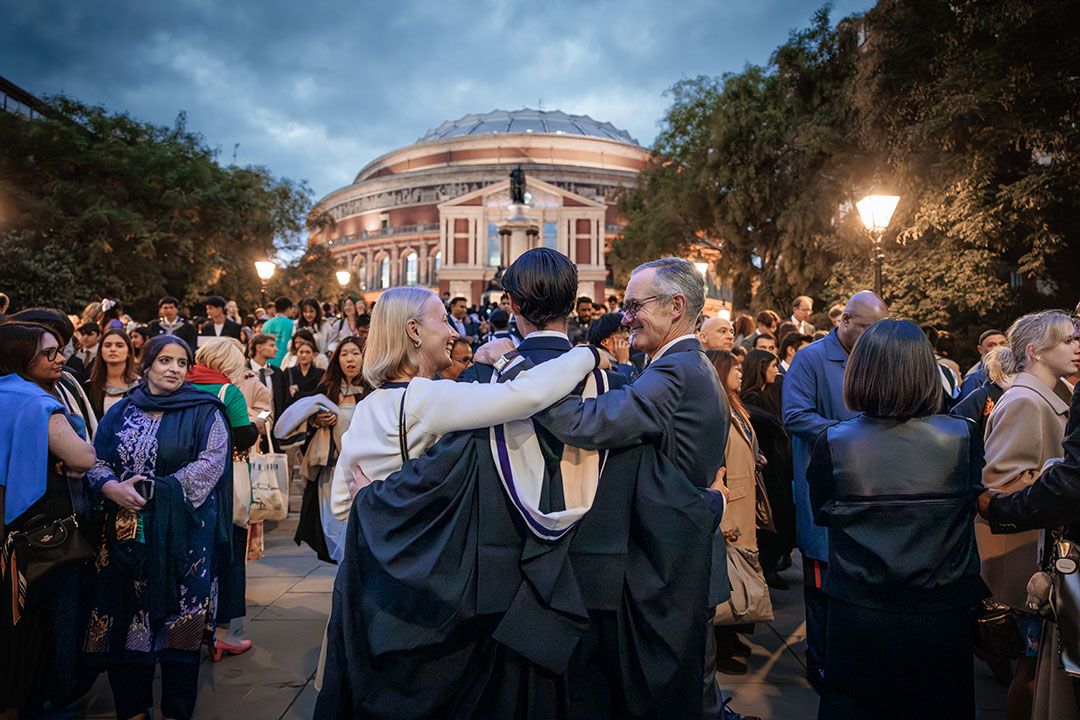 A graduate outside the Royal Albert Hall with family