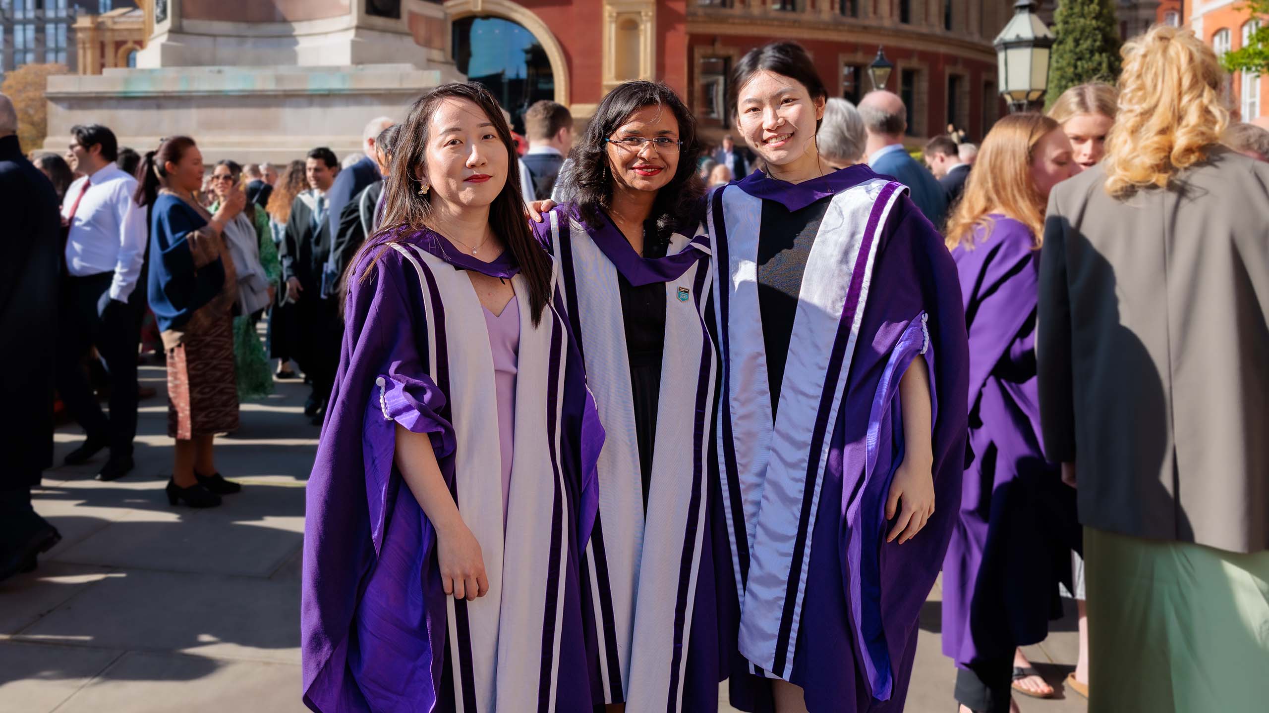 Students wearing purple gowns