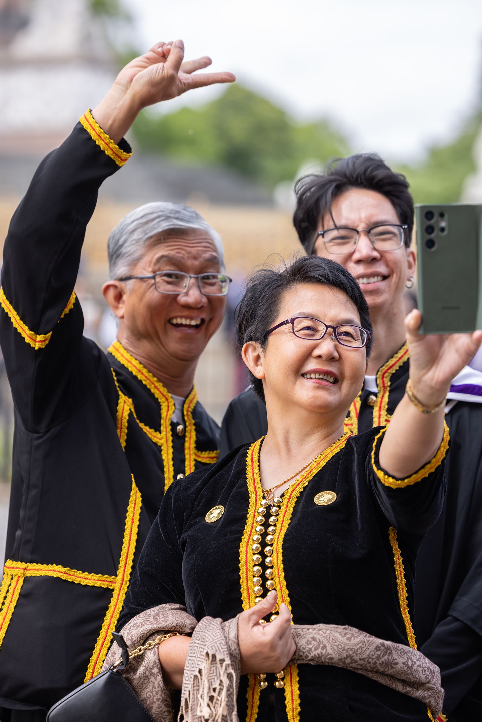 A graduate and their family pose for a photo