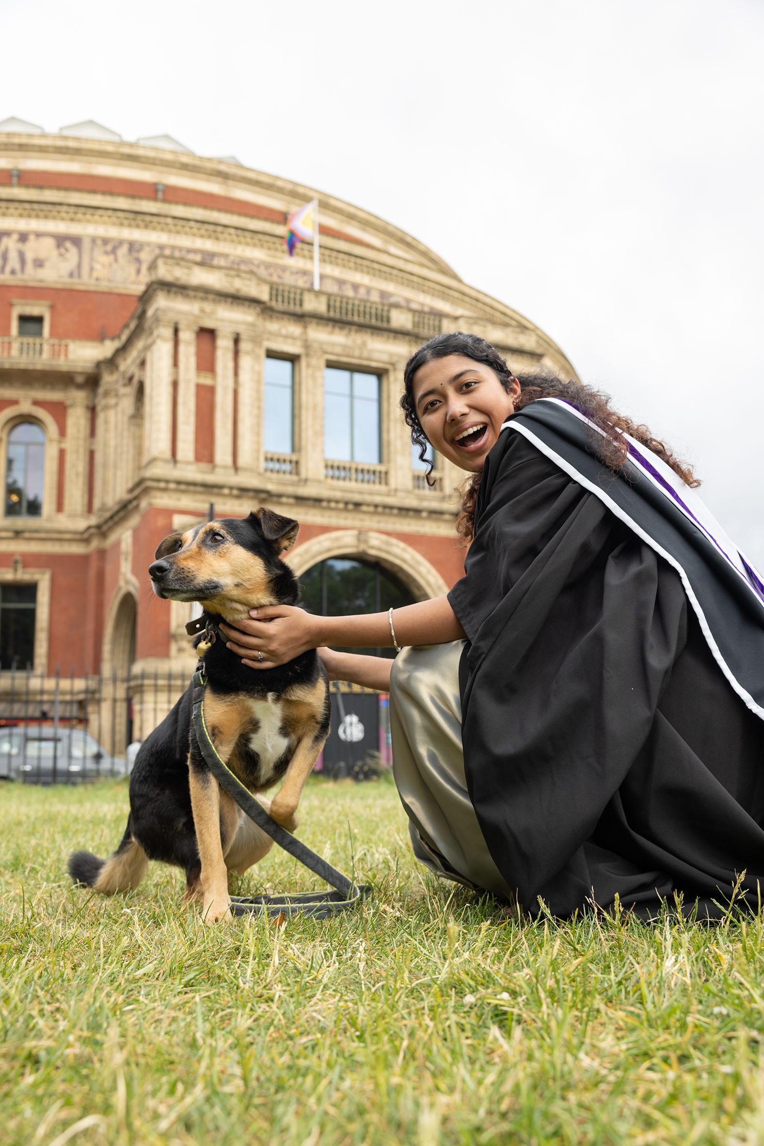 A graduate and their dog