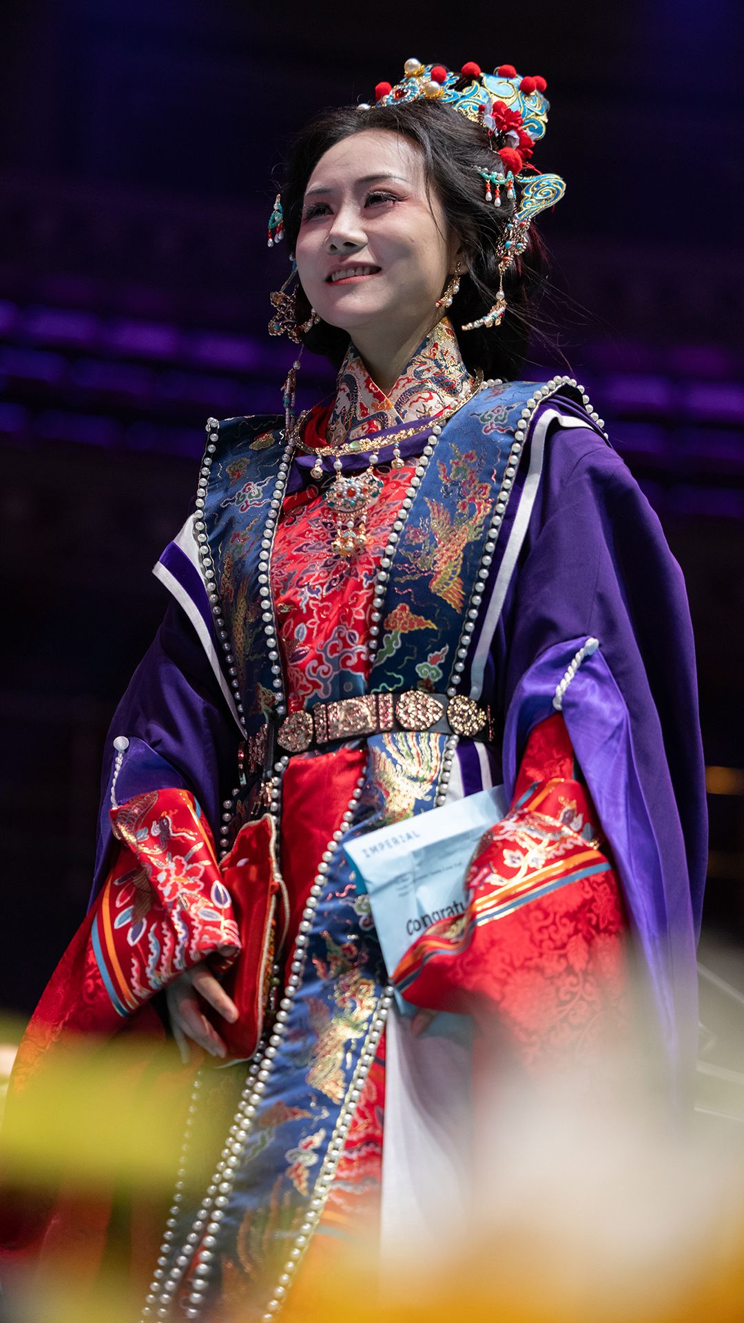 A graduate crossing the stage